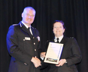 Chief Constable Mike Veale presenting Sarah Pickles with her certificate