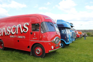 A Bensons Sweets van and some larger vehicles.